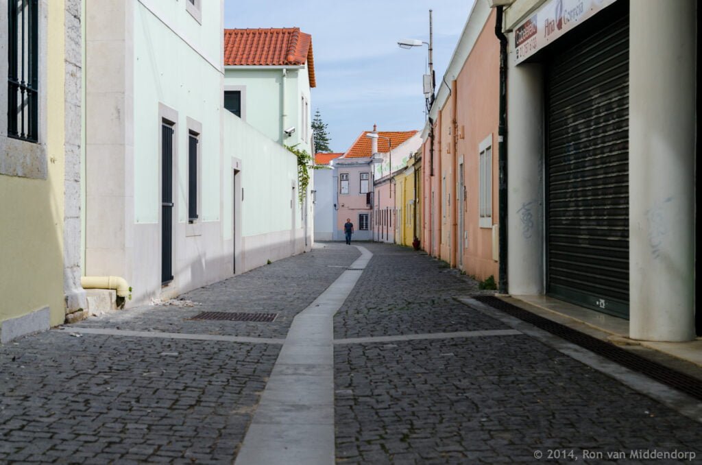 photo: man in the middle of the street in Telheiras